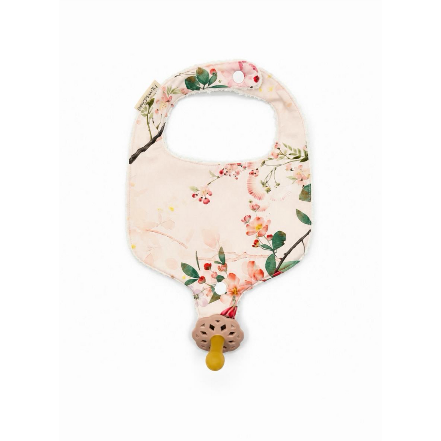 Floral-patterned baby teether on a white background