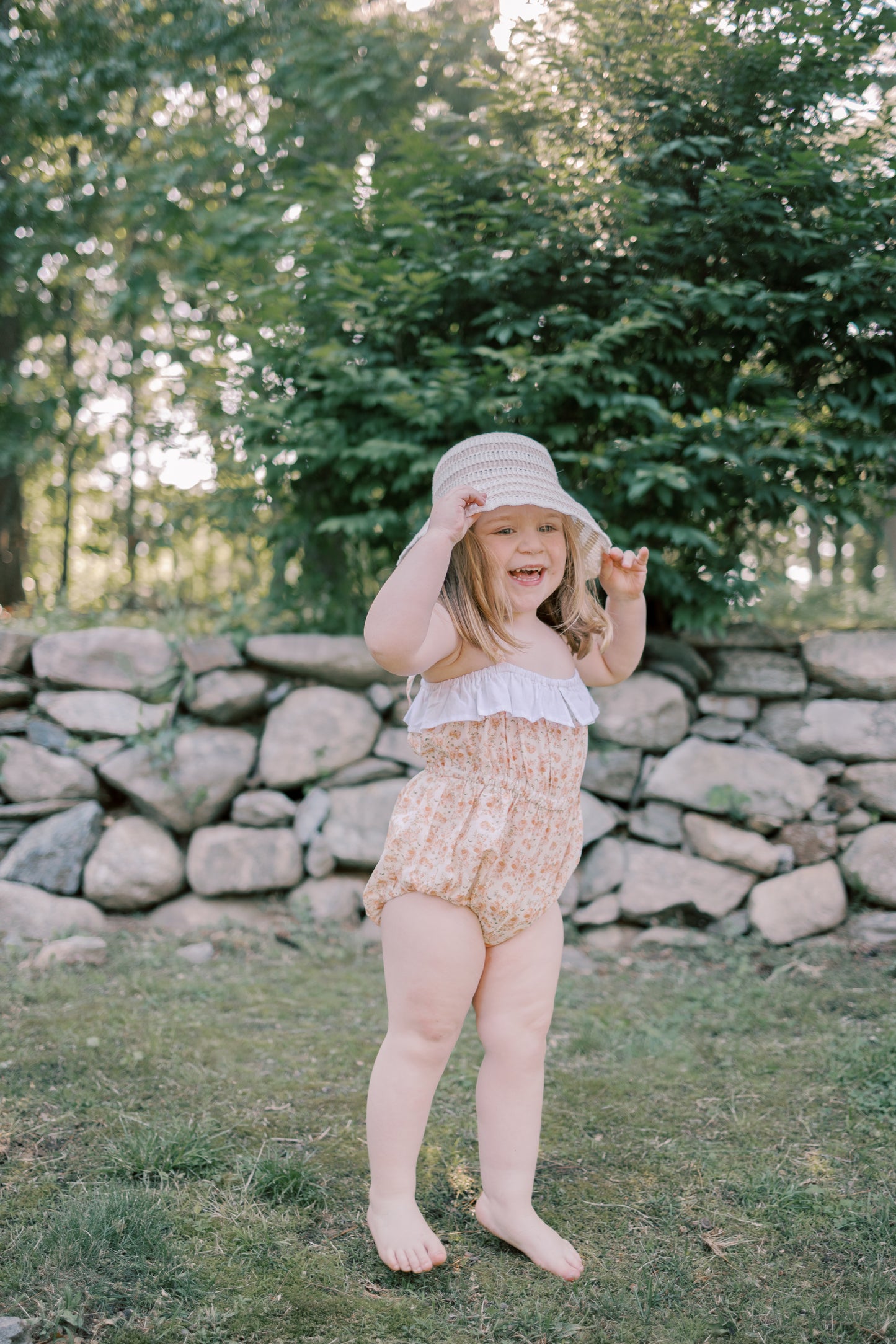 Maia Romper in a Peach Blossom floral print with adjustable straps