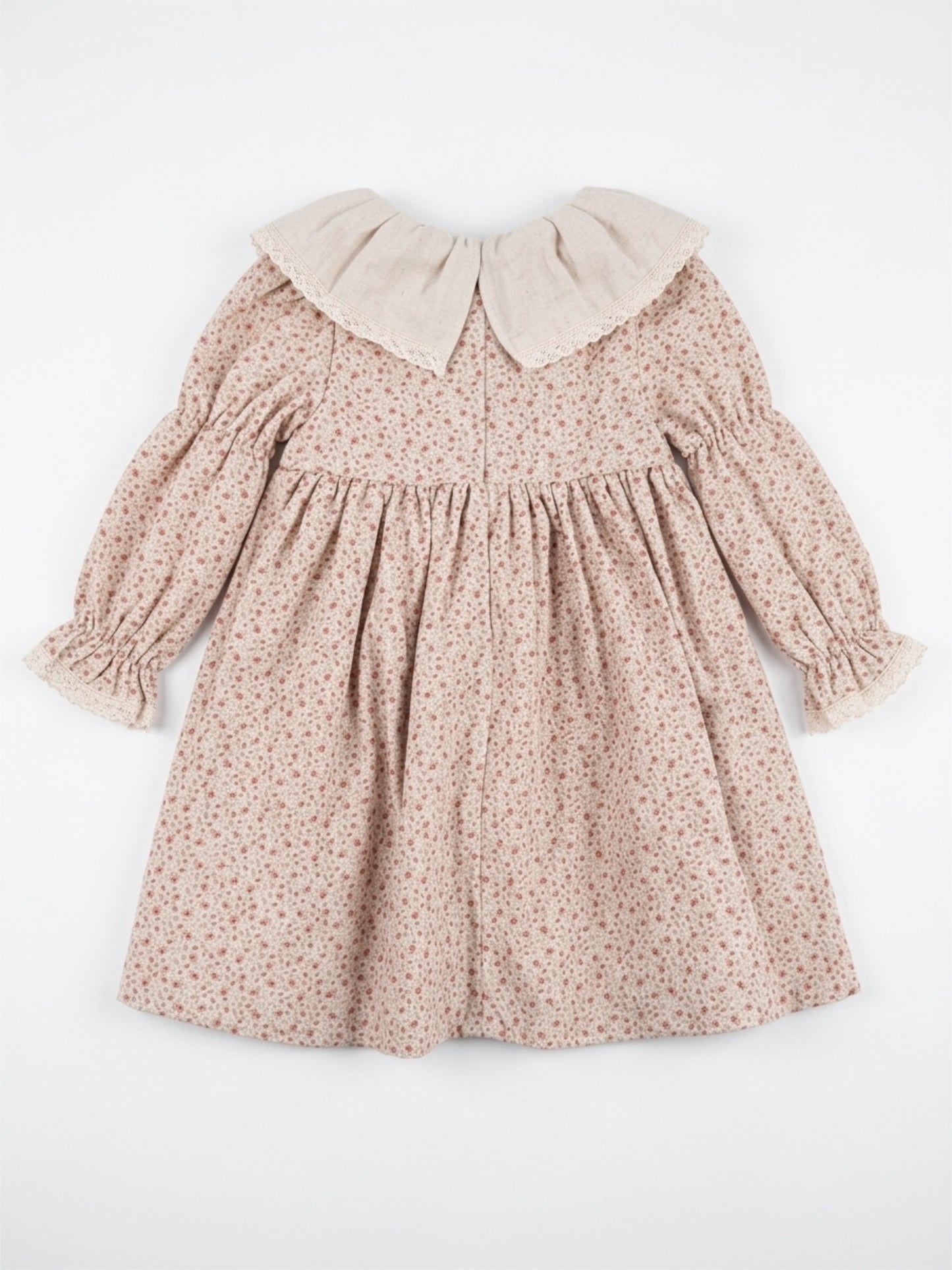 Floral dress with a beige collar on a white background