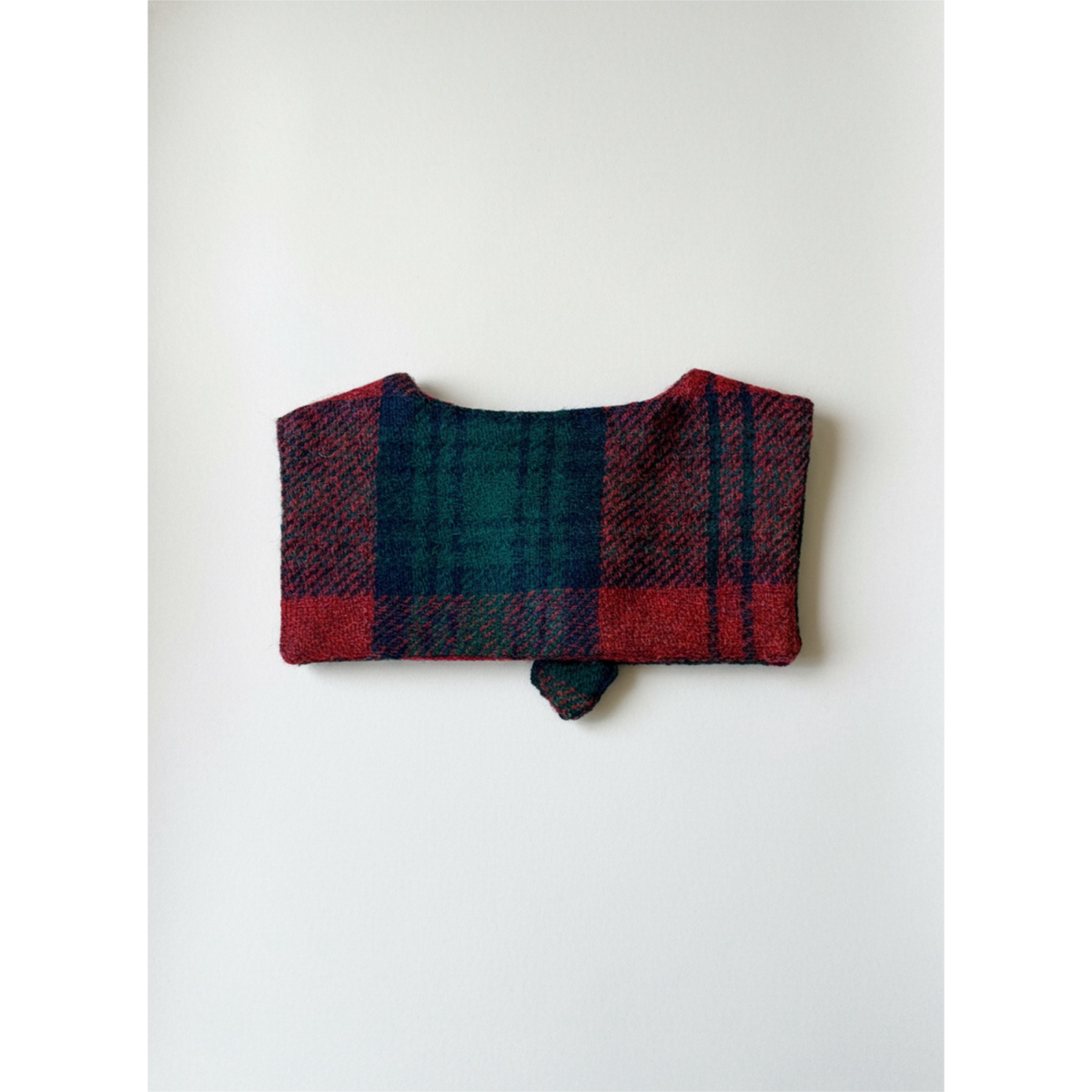 Plaid patterned pouch on a white background