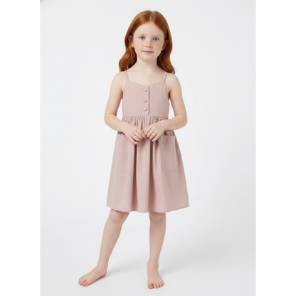 Young girl wearing a pink dress on a white background