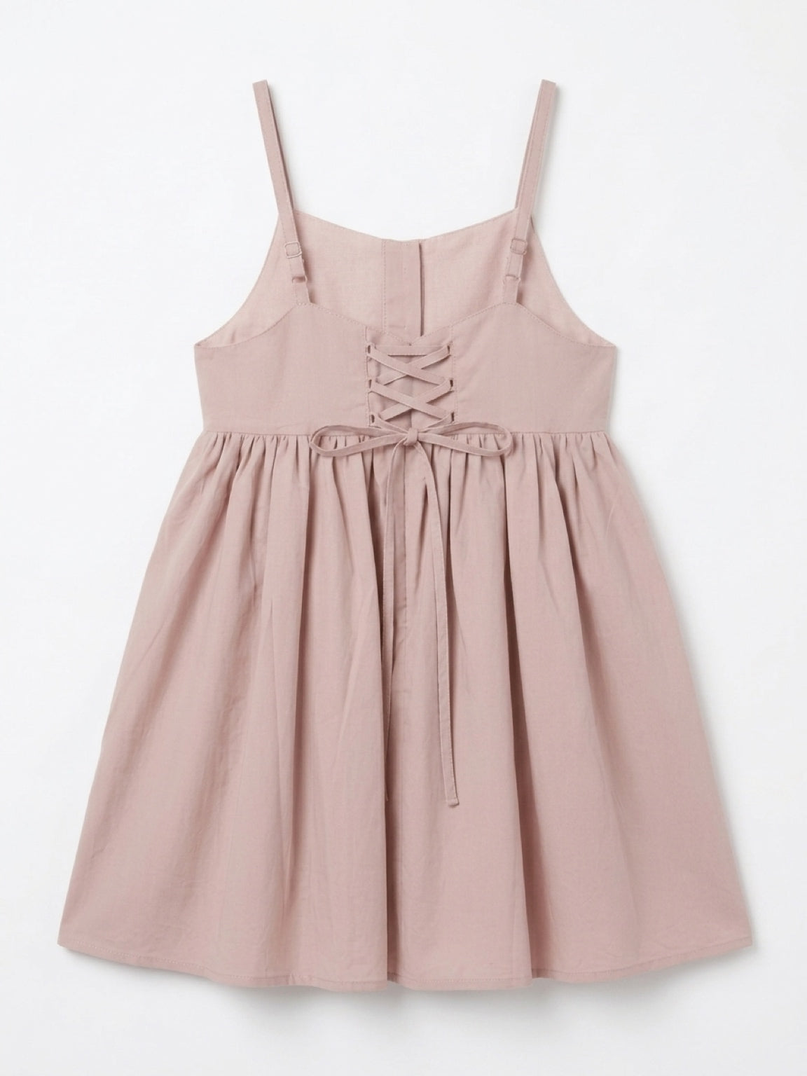 Pink dress with lace-up front on a white background