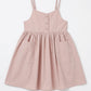 Pink dress with thin straps on a white background