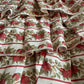 Fabric with red apple pattern and ruffled edge