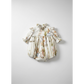 Baby romper with three-quarter  sleeve ruffle stand collar bubble with covered buttons at the back, floral and rabbit character print on a white background