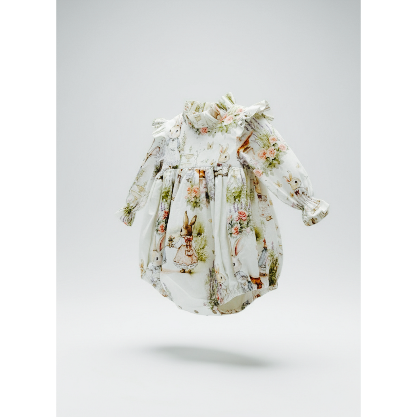 Baby's long sleeve ruffle stand collar bubble with covered buttons at the back, floral and rabbit character print on a white background