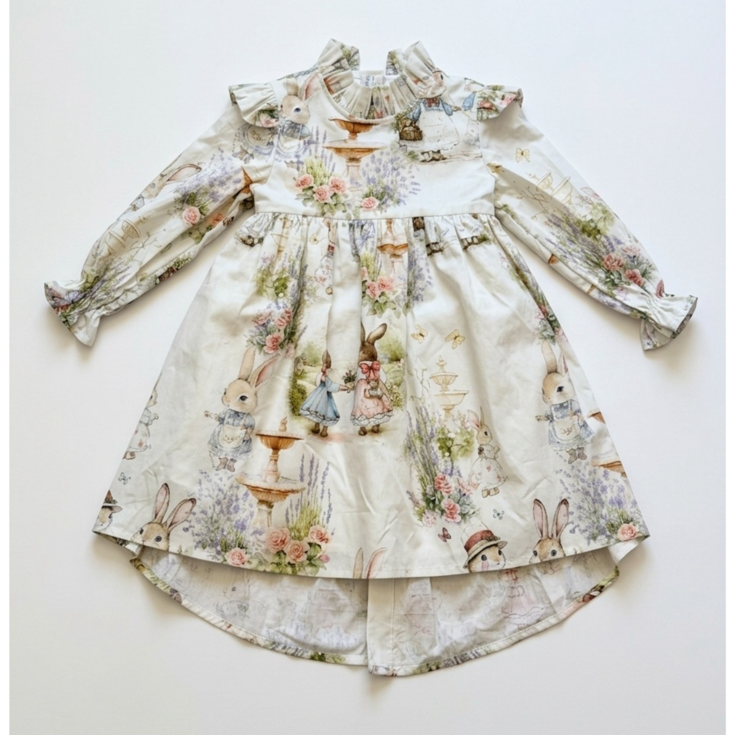 Children's dress with floral and animal print on a white background