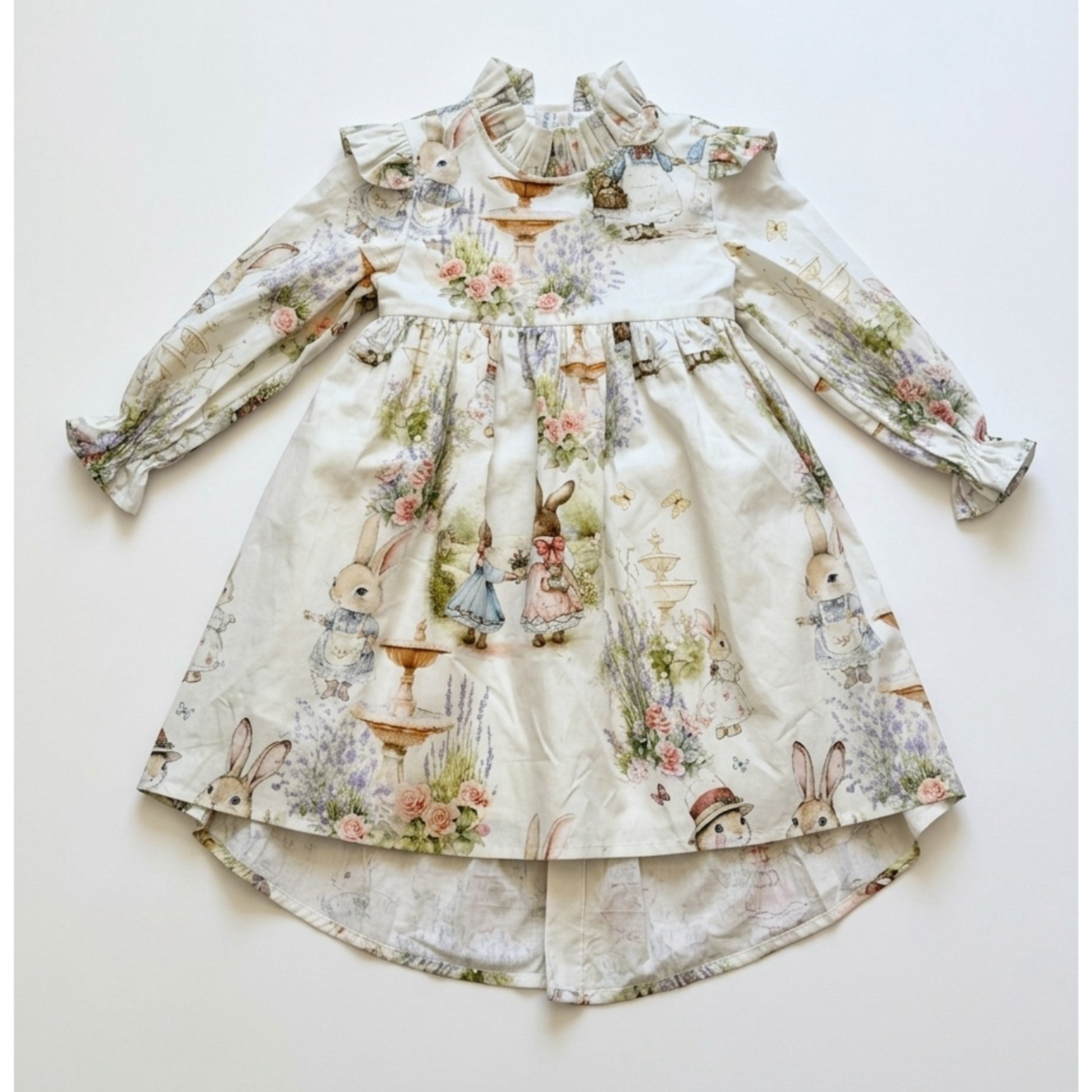 Children's dress with floral and animal print on a white background