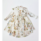 Children's dress with vintage-style rabbit print on a white background
