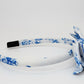 White headband with blue floral pattern on a white background