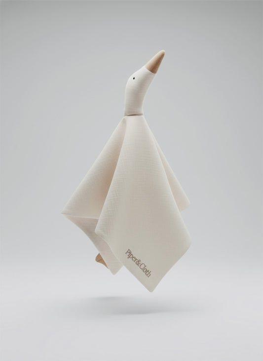 Goose lovey blanket with embroidered 'Piper & Cloth' branding on a off-white background