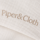 Close-up of 'Piper & Cloth' logo on a textured fabric background