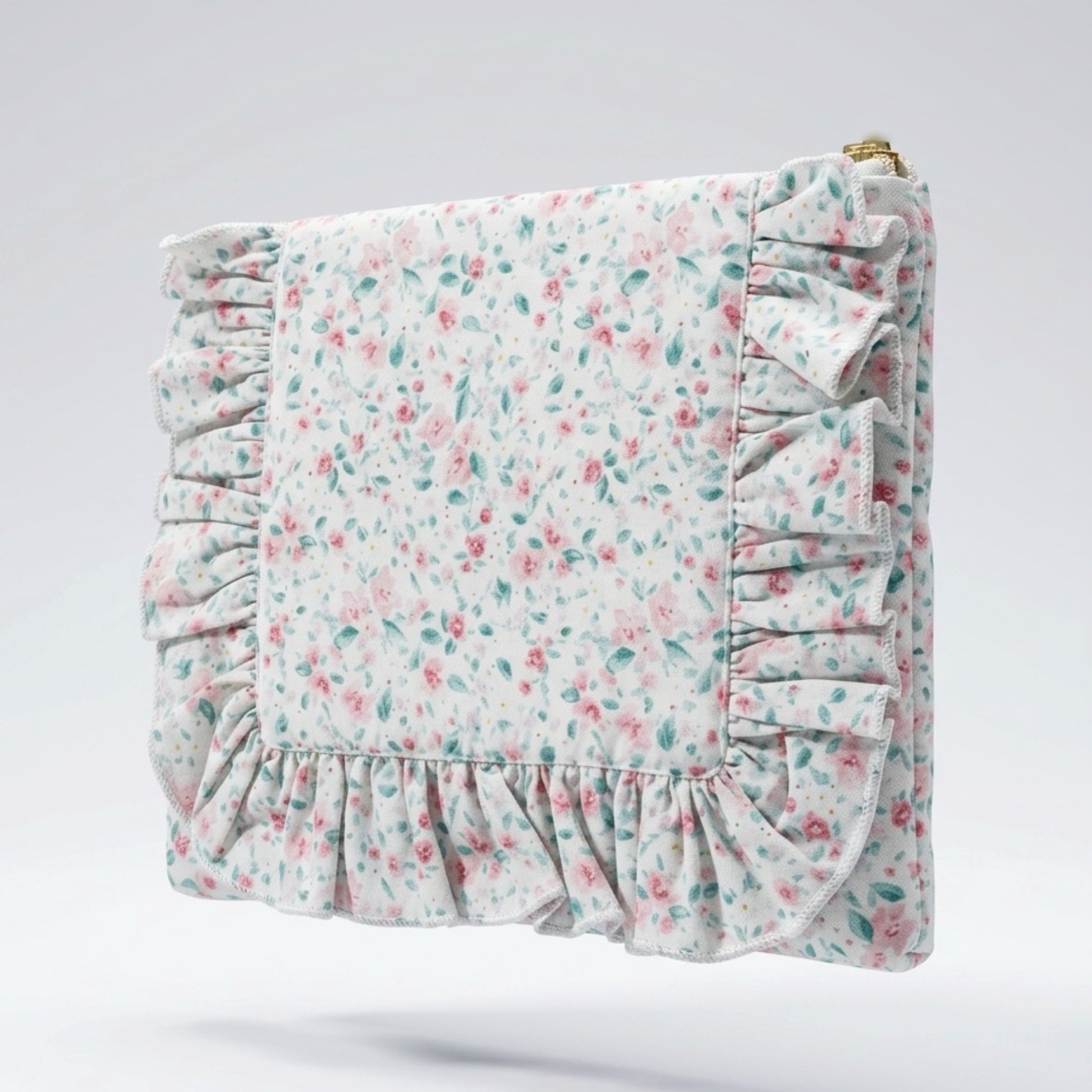 Floral patterned pouch with ruffled edges on a light gray background