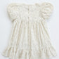 White floral dress with puff sleeves on a white background
