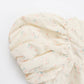Floral-patterned fabric swatch on a white background
