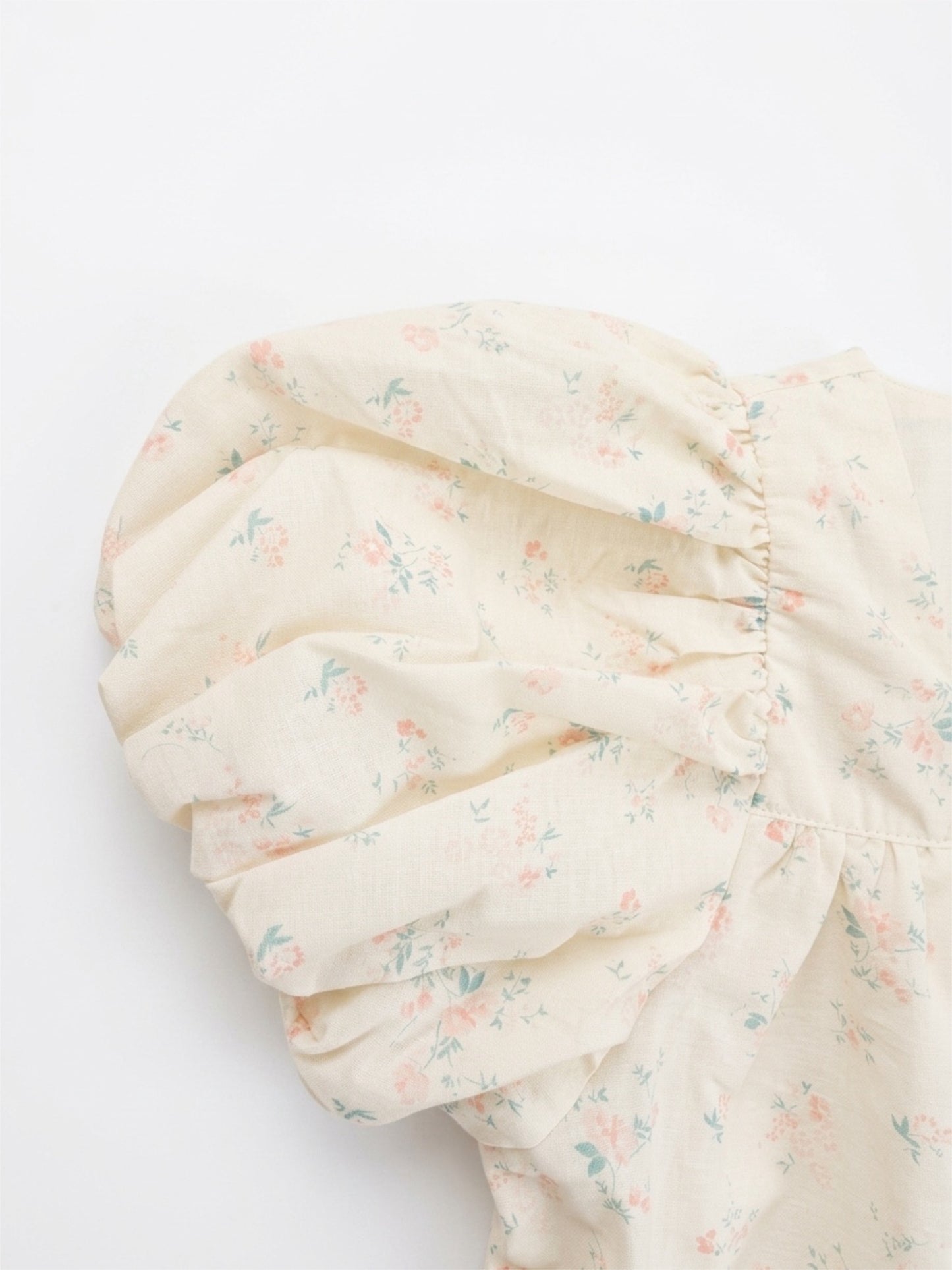 Floral-patterned fabric swatch on a white background