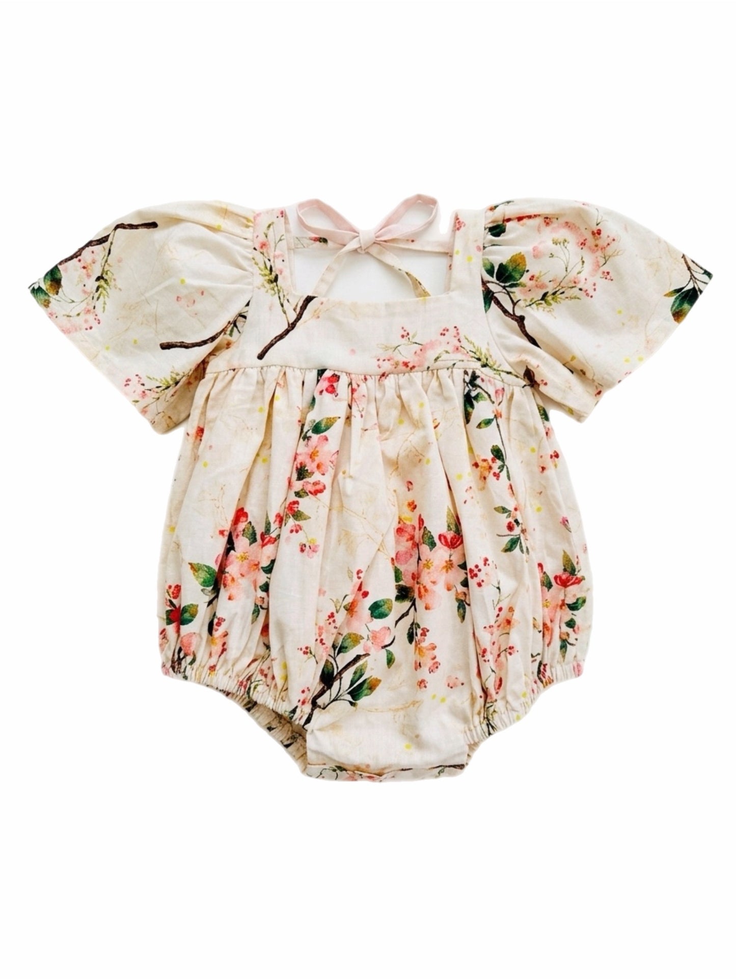 Floral baby romper with puff sleeves on a white background