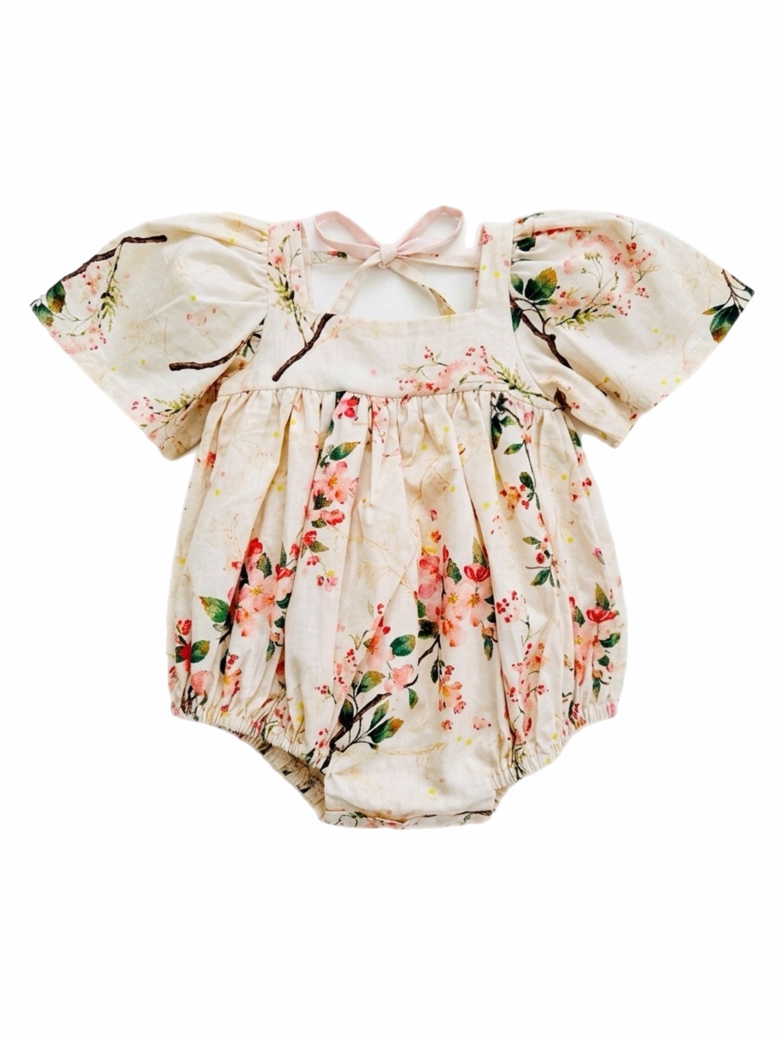 Floral baby romper with puff sleeves on a white background