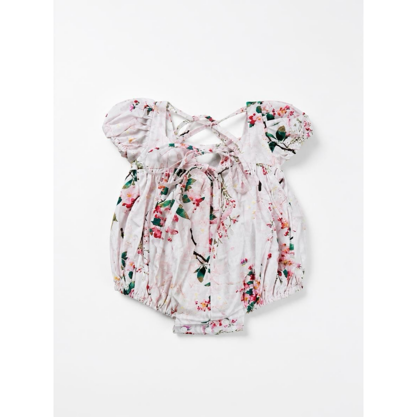 Floral baby romper on a white background