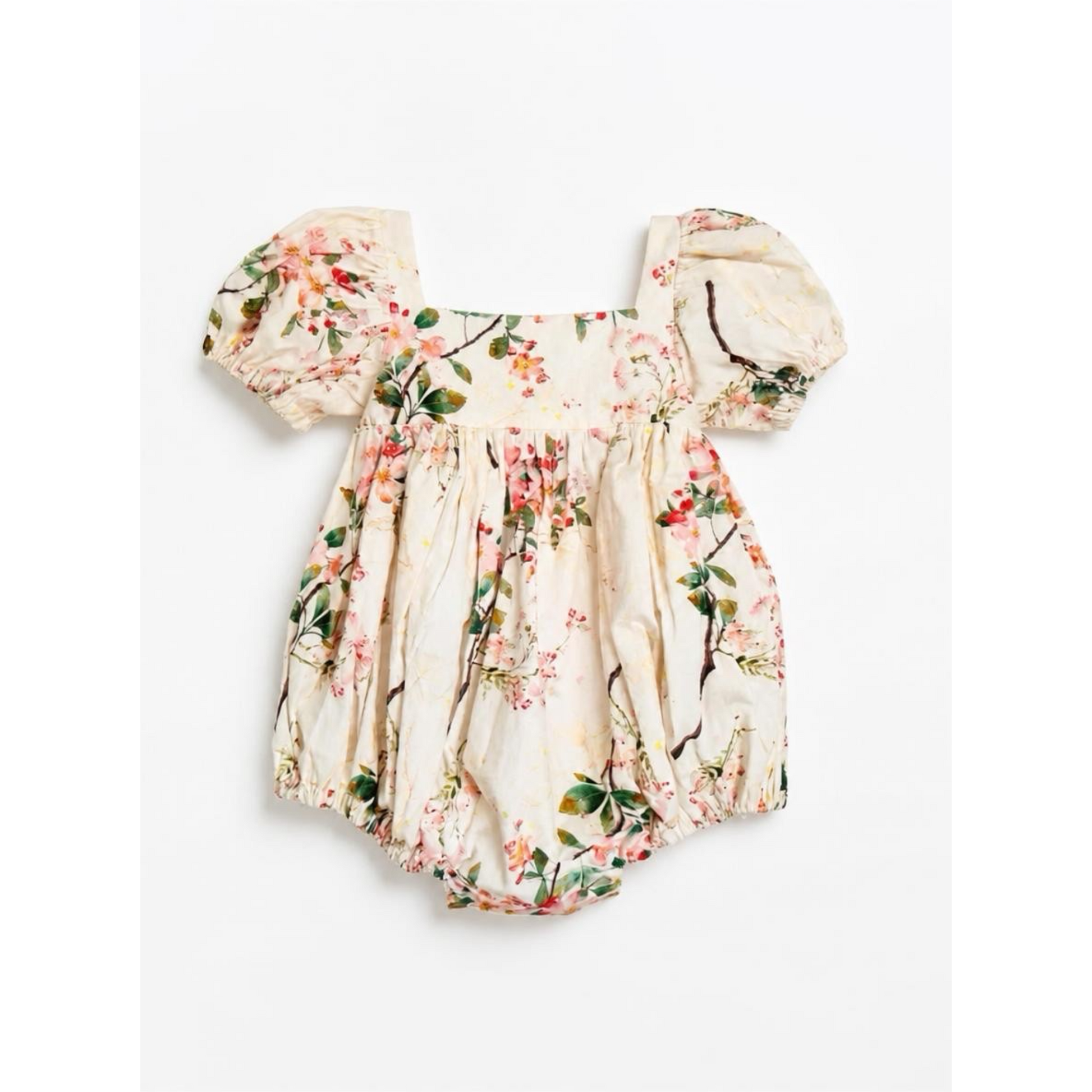 Floral baby romper with matching hat on a white background