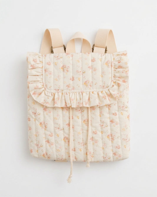Floral-patterned backpack with ruffled details on a white background