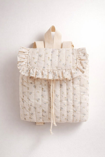 Floral-patterned backpack with ruffles on a white background