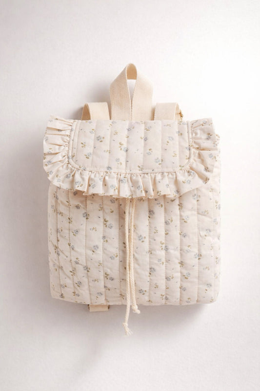 Floral-patterned backpack with ruffles on a white background
