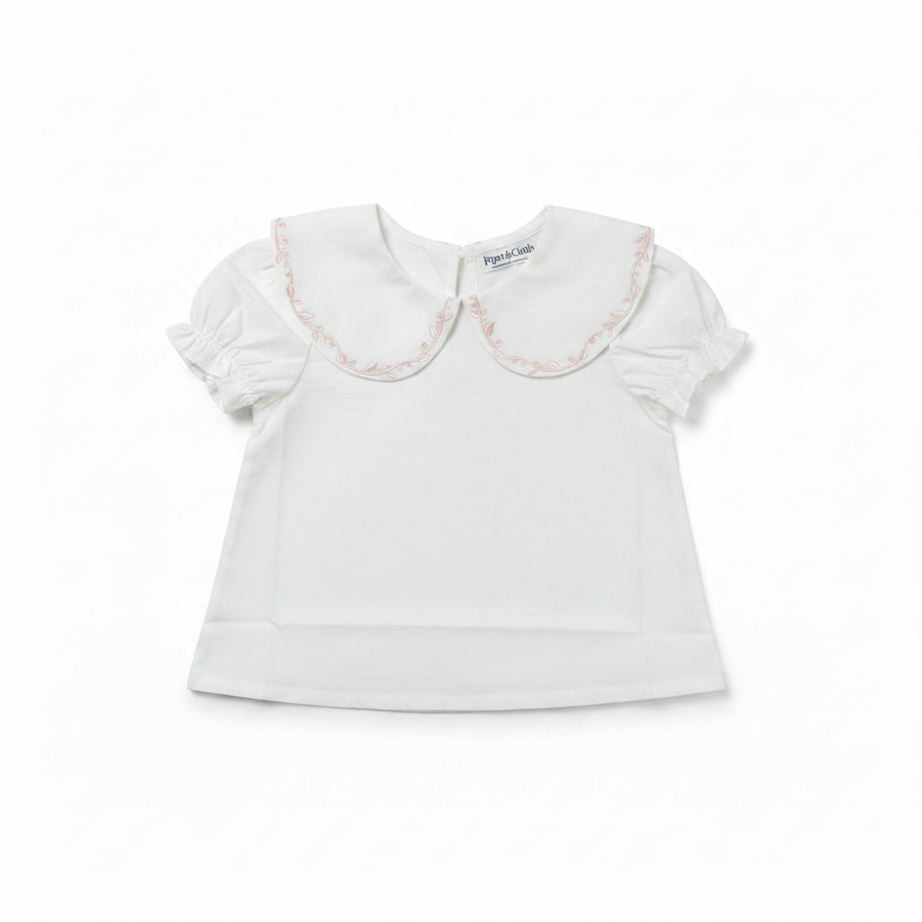 White blouse with lace collar on a white background