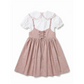 Pink dress with white collar on a white background