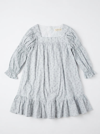 Light blue dress with floral pattern on a white background