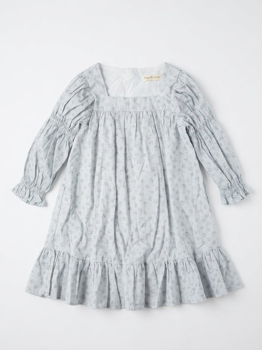 Light blue dress with floral pattern on a white background