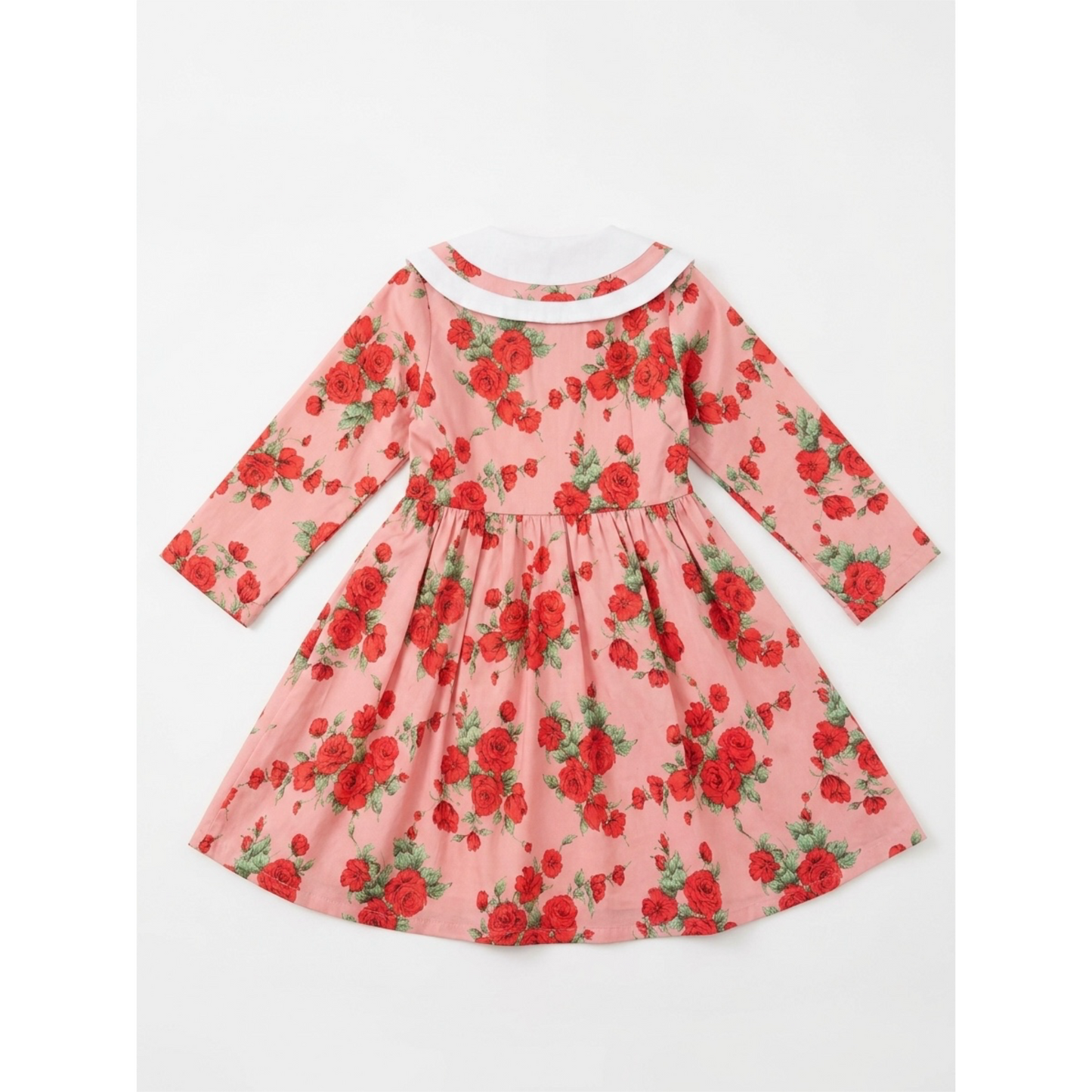 Pink dress with red floral pattern on a white background