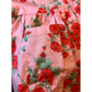 Close-up of a pink garment with red floral pattern