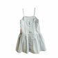 Light gray dress with button details on a white background