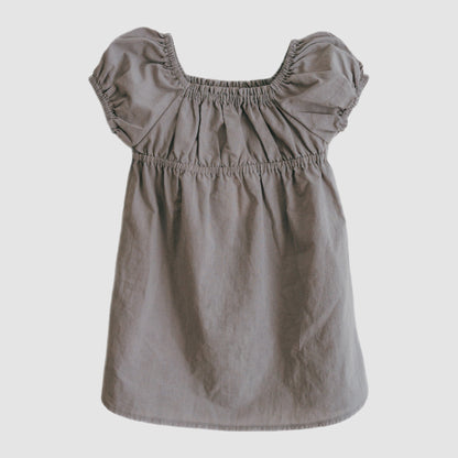 Gray dress with ruffled sleeves on a light gray background
