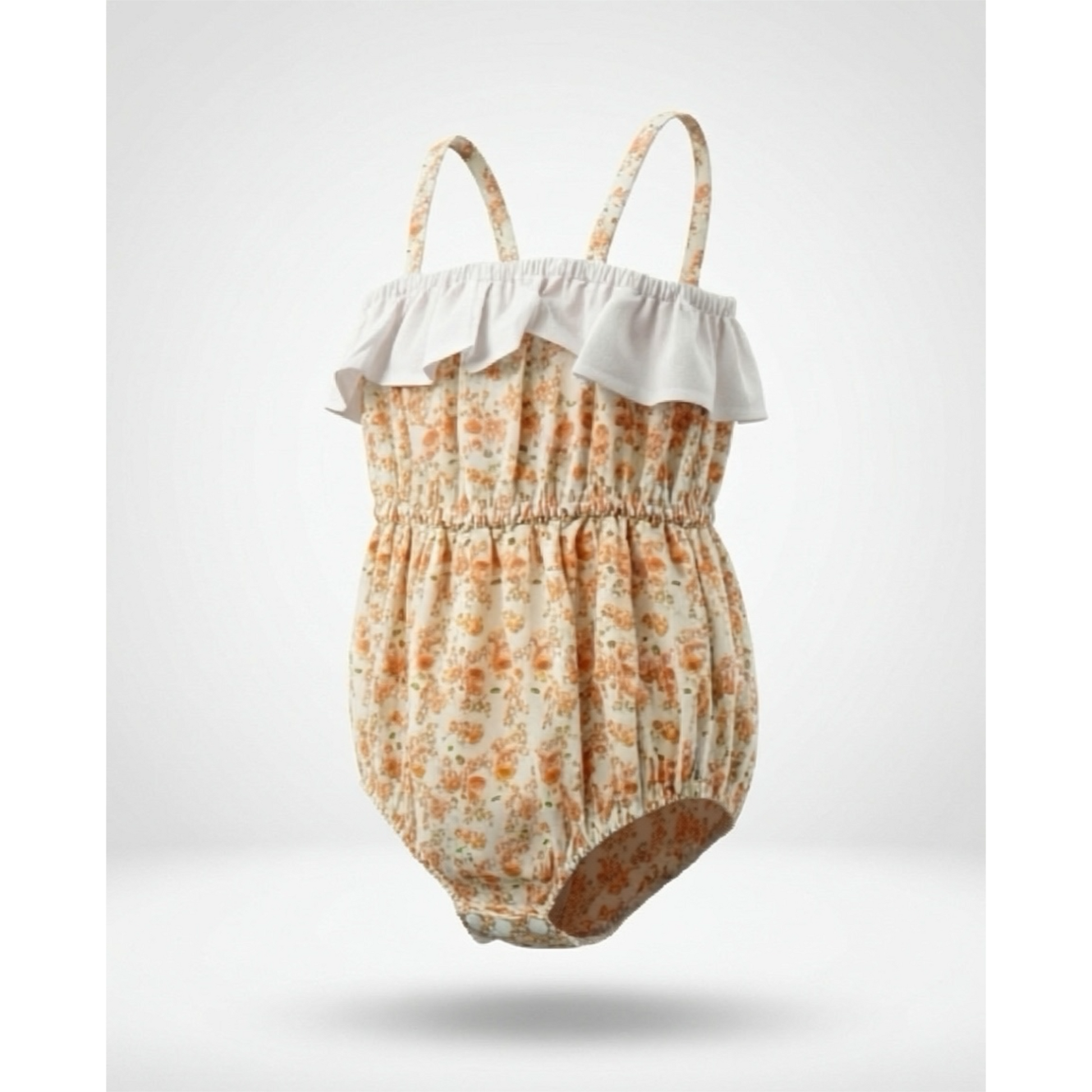 Baby romper with floral pattern and white ruffle on a light gray background