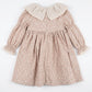 Floral dress with a beige collar on a white background