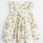Floral dress with blue and green flowers on a white background