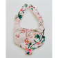 Floral-patterned baby bib on a white background