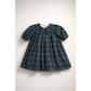 Green plaid dress with a large bow on a white background