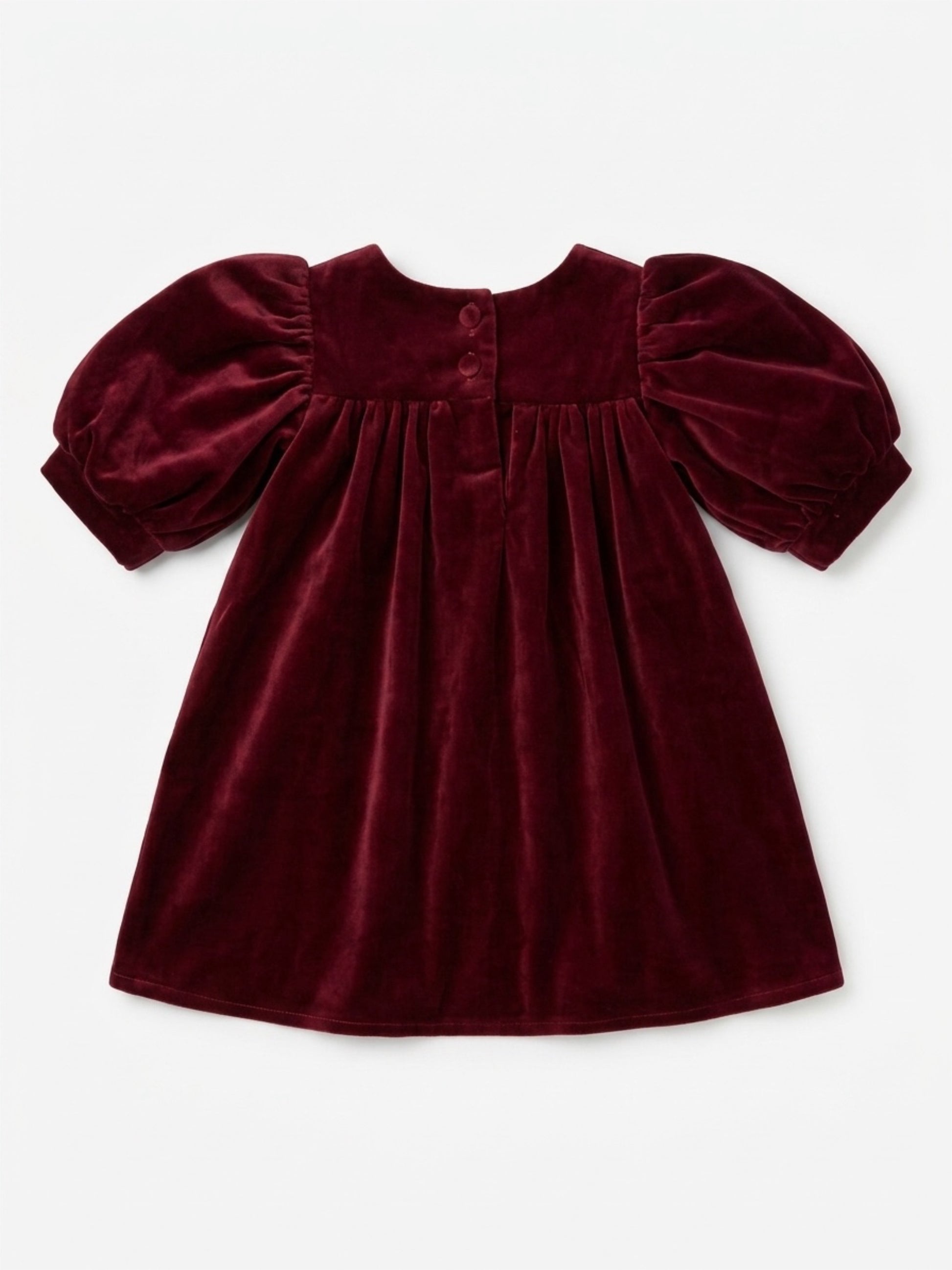Maroon velvet dress with puff sleeves on a white background