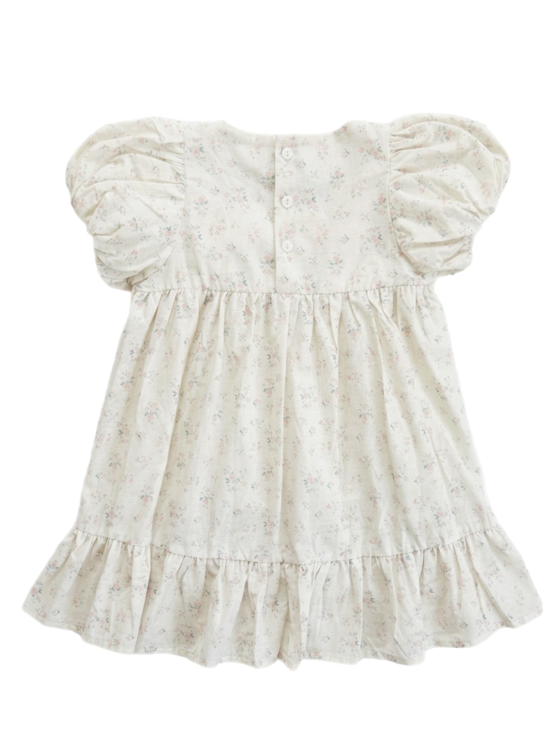 White floral dress with puff sleeves on a white background