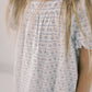 Girl wearing a floral dress with a plain background