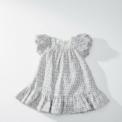 Baby dress with a pattern on a white background