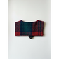 Plaid patterned pouch on a white background